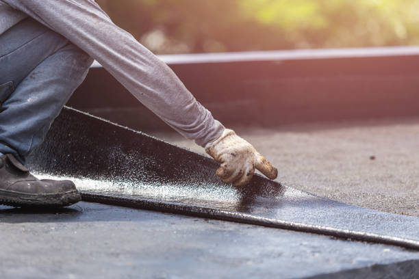 Professional Basement Waterproofing technician working in New Milford, IL